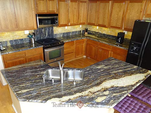 Granite kitchen countertops with custom backsplashes