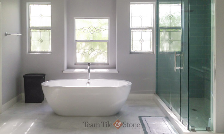 Glass enclosed tiled shower